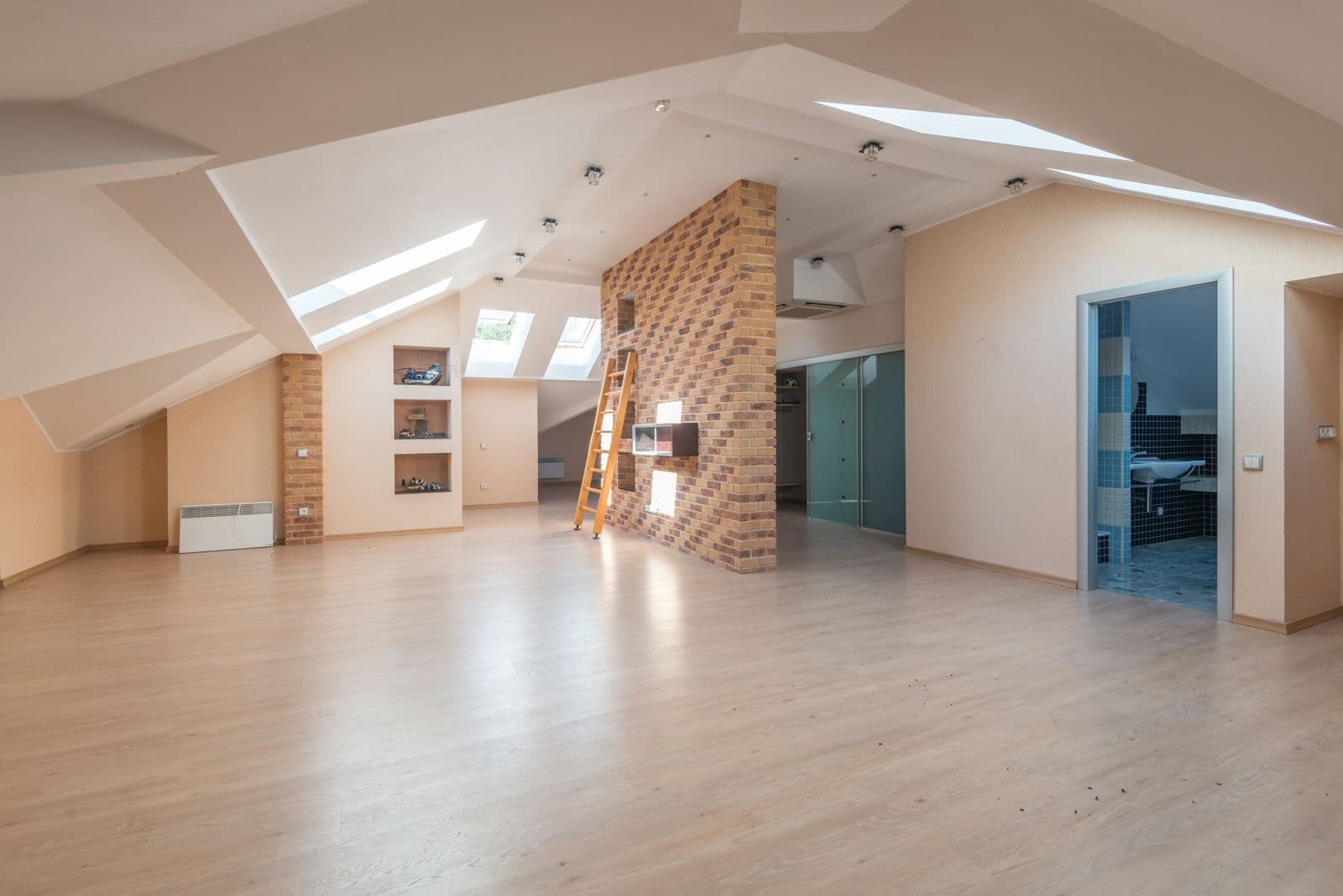 Bright, newly renovated apartment interior with skylights