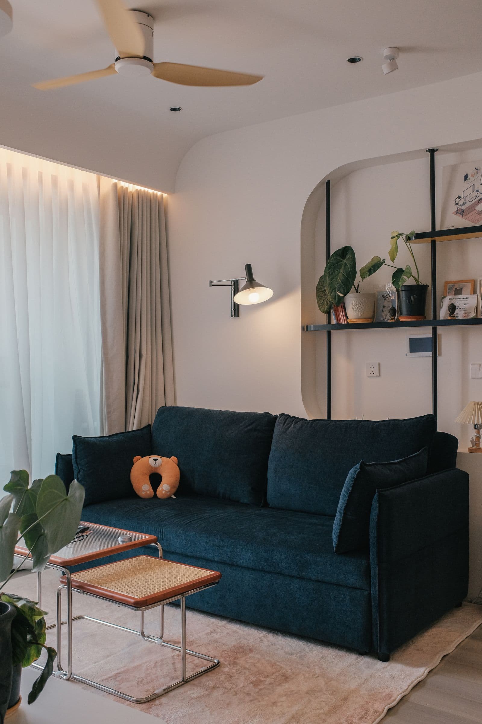Bright, tidy living room with a navy sofa in a Dublin home